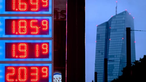 Gas prices are displayed at a gas station next to the headquarters of the European Central Bank, rear, in Frankfurt, Germany, on July 28, 2023.