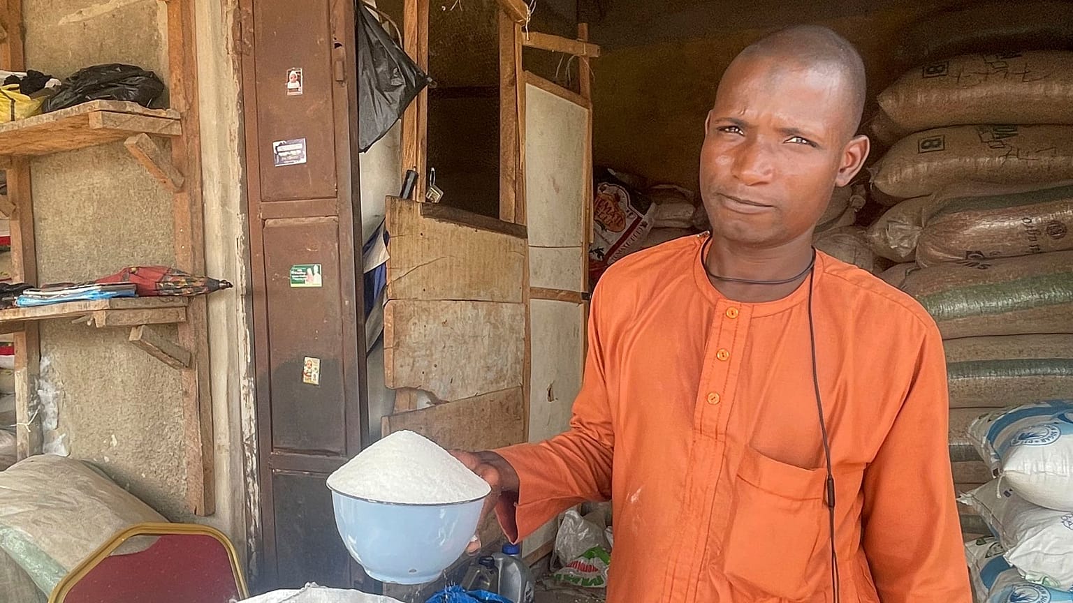 Isa Ahmed sells sugar at his shop at a market in Abuja, Nigeria: Sugar worldwide is trading at the highest prices since 2011.