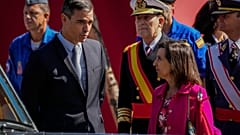 Spain's Prime Minister Pedro Sanchez, left, talks with Spain's Defense Minister Margarita Robles.