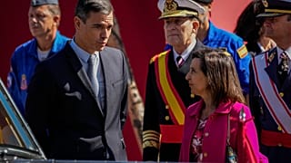 Spain's Prime Minister Pedro Sanchez, left, talks with Spain's Defense Minister Margarita Robles.