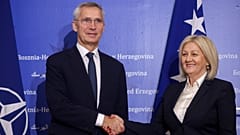 NATO Secretary General Jens Stoltenberg shakes hands with the President of the Council of Ministers of Bosnia and Herzegovina Borjana Kristo 