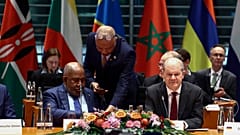 German Chancellor Olaf Scholz, presides over the "Compact with Africa" investment summit.