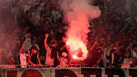 Chile's Colo Colo fans light fireworks during a Copa Libertadores soccer match against Peru's Alianza Lima in Santiago, Chile.