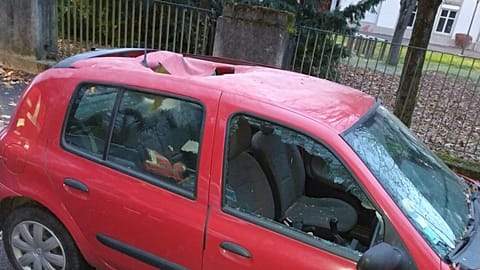 The car had a large hole punched in its roof