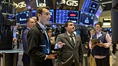 Traders work on the floor of the New York Stock Exchange during opening bell in New York City 