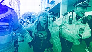 Environmental activist Greta Thunberg is taken away by police officers during the Oily Money Out protest outside the Intercontinental Hostel in London, October 2023