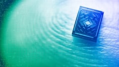 A silicon spin qubit chip on a human fingertip, June 2023