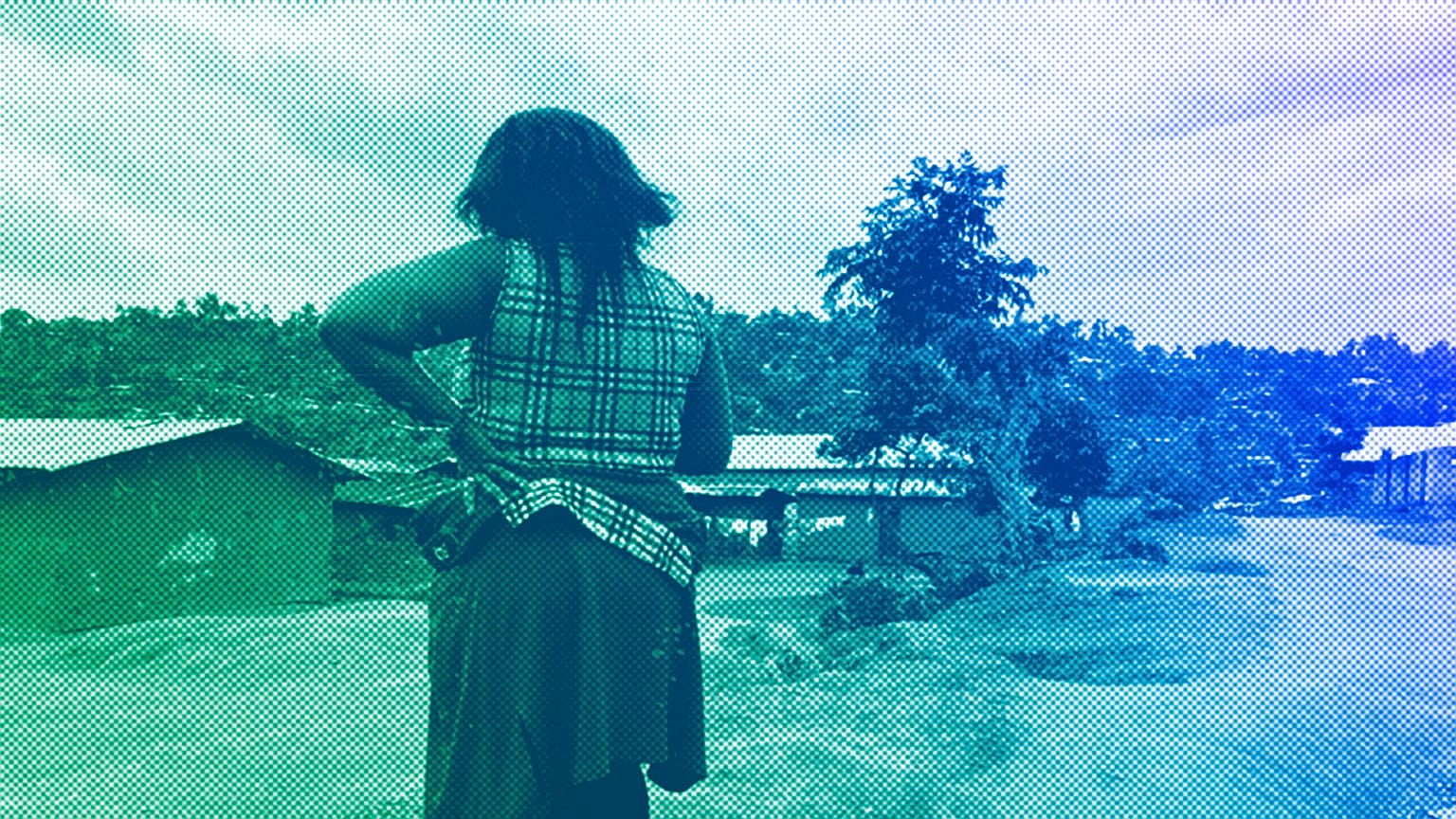 A woman stands near her home in Beni, eastern Congo, March 2021
