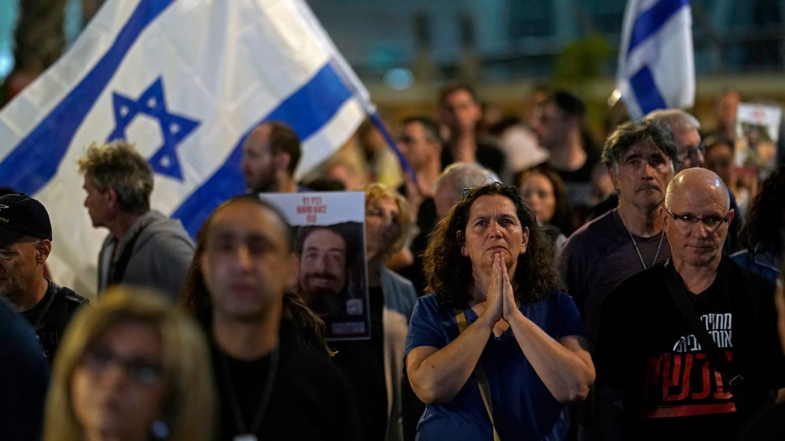 People participate in a show of solidarity with hostages being held in the Gaza Strip, near the Museum of Art in Tel Aviv, Israel, Saturday, Nov. 25, 2023