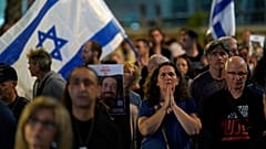 People participate in a show of solidarity with hostages being held in the Gaza Strip, near the Museum of Art in Tel Aviv, Israel, Saturday, Nov. 25, 2023