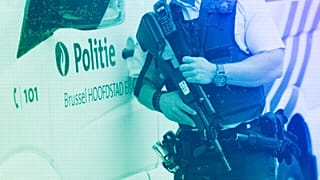 Police secure an area prior to a media conference in Brussels, August 2016