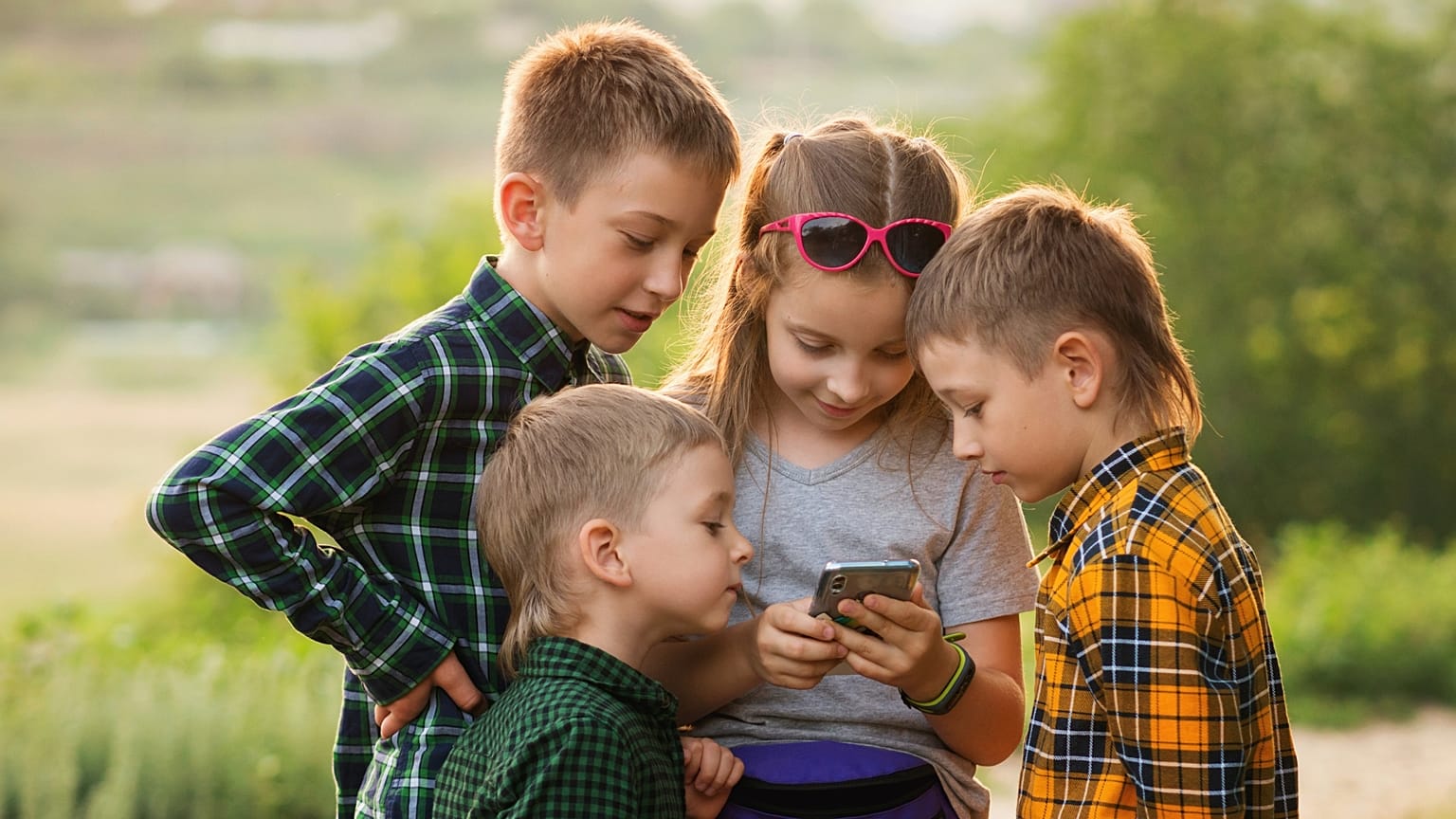 Kids checking a phone