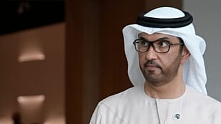 COP28 President Sultan al-Jaber walks through the venue ahead of the UN climate summit.