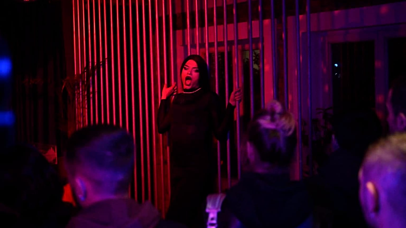 A drag performer performs on stage at the only LGBT pub Bubble in Pristina on November 4, 2023