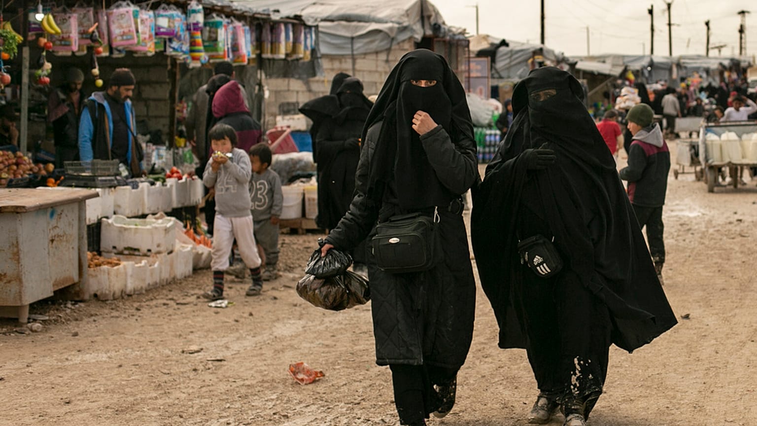 Women shop in the marketplace at al-Hol camp, home to families of Islamic State fighters, in Hasakeh province, Syria, on March 31, 2019