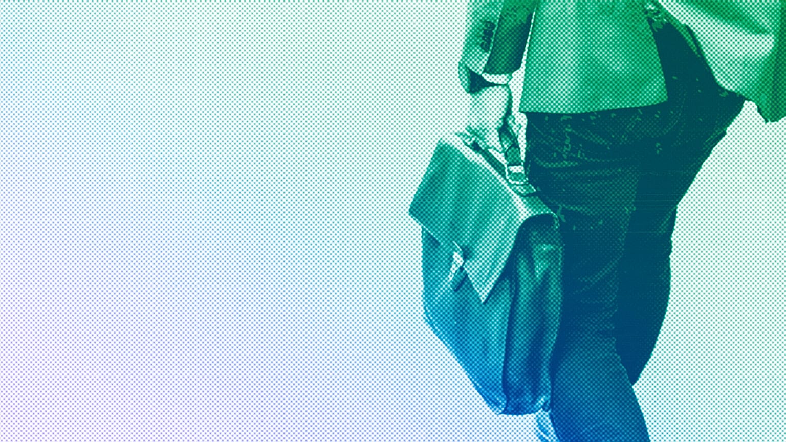 A man is walking carrying a brown leather bag in downtown Stockholm, June 2018