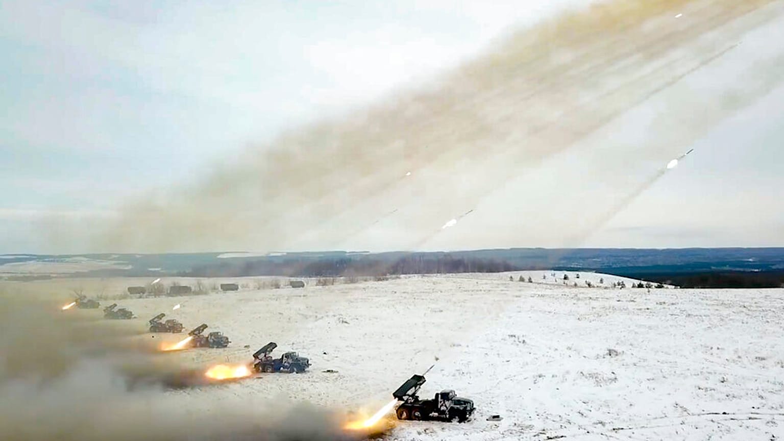 FILE - Russian Defense Ministry Press Service, Russian rocket launchers fire during military drills near Orenburg in the Urals, Russia, Thursday, Dec. 16, 2021. 