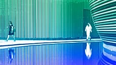 People walk through the venue for the COP28 UN Climate Summit in Dubai, November 2023
