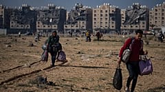 Palestinians flee from their neighbourhood in Khan Younis, Gaza Strip, during the ongoing Israeli bombardment, Saturday, Dec. 2, 2023. 