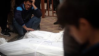 Palestinians mourn their relatives killed, in the Israeli bombardment, at the Nasser hospital in town of Khan Younis, southern Gaza Strip, Wednesday, Nov. 22, 2023.
