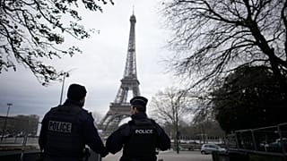 French policemen patrol near the Eiffel Tower 