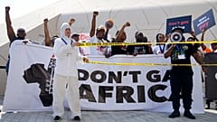 Activists participate in a demonstration against fossil fuels at the COP28 U.N. Climate Summit, Tuesday, Dec. 5, 2023, in Dubai, United Arab Emirates. 