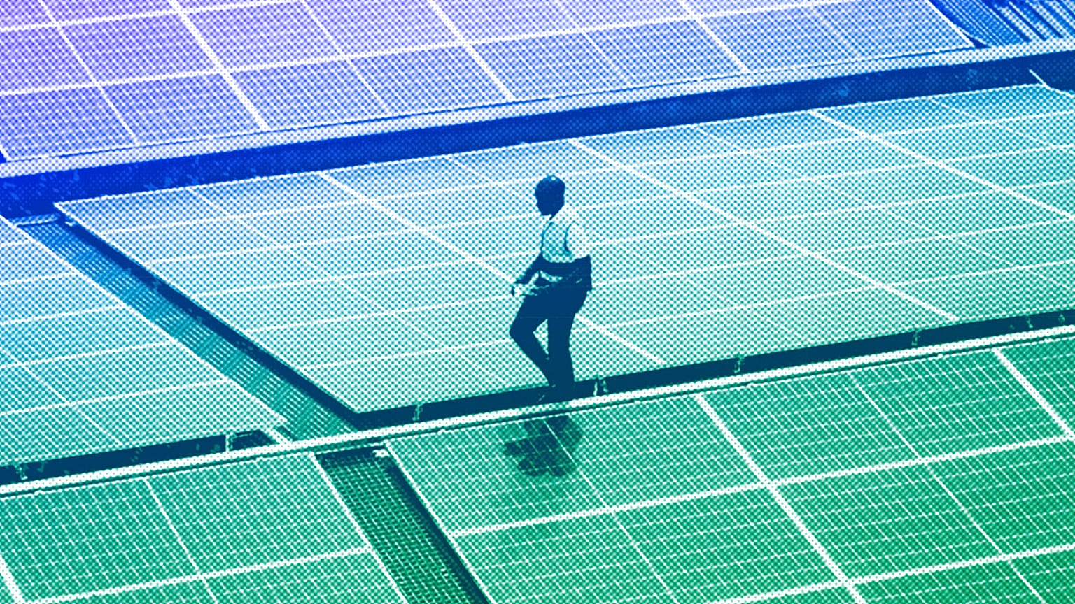 Mark Munyua, CP solar's technician, examines solar panels on the roof of a company in Nairobi, September 2023