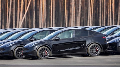 Tesla cars are parked at the construction site of the new Tesla Gigafactory for electric cars in Gruenheide near Berlin, Germany, Friday, March 18, 2022.