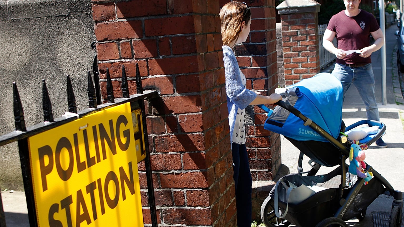 A woman leaves a polling station after casting her vote in the referendum on the 8th Amendment of the Irish Constitution, in Dublin, Ireland, Friday May 25, 2018.