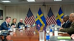 Swedish Defense Minister Pal Jonson, left, speaks during a meeting with Defense Secretary Lloyd Austin, right, at the Pentagon on Tuesday, Dec. 5, 2023, in Washington. 