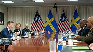 Swedish Defense Minister Pal Jonson, left, speaks during a meeting with Defense Secretary Lloyd Austin, right, at the Pentagon on Tuesday, Dec. 5, 2023, in Washington. 