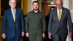 FILE - Ukrainian President Zelenskyy, walks with Senate Minority Leader Mitch McConnell of Ky. and Senate Majority Leader Chuck Schumer of N.Y. at Capitol Hill