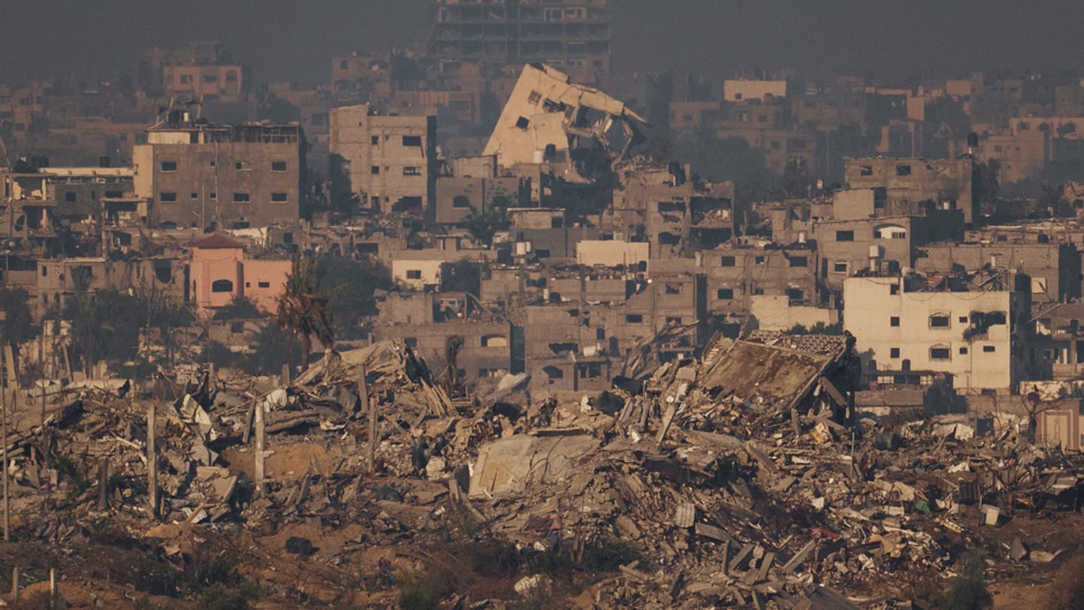 Destroyed buildings from Israeli airstrike are seen in the northern Gaza Strip, as seen from southern Israel, Thursday, Dec. 7, 2023.