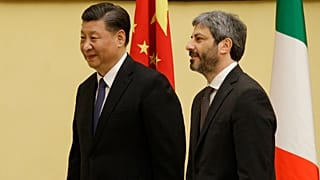 Chinese President Xi Jinping is greeted by chamber speaker Roberto Fico as he visits the Italian lower chamber in Rome Friday, March 22, 2019.