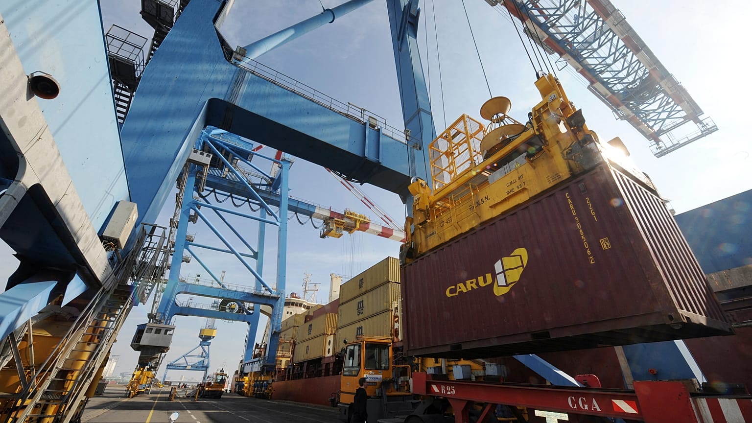 Ship-to-shore gantry cranes unload a cargo, on February 27, 2012, at the Montoir-de-Bretagne terminal, western France.