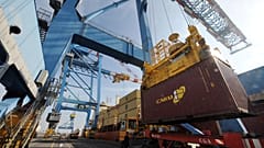 Ship-to-shore gantry cranes unload a cargo, on February 27, 2012, at the Montoir-de-Bretagne terminal, western France.