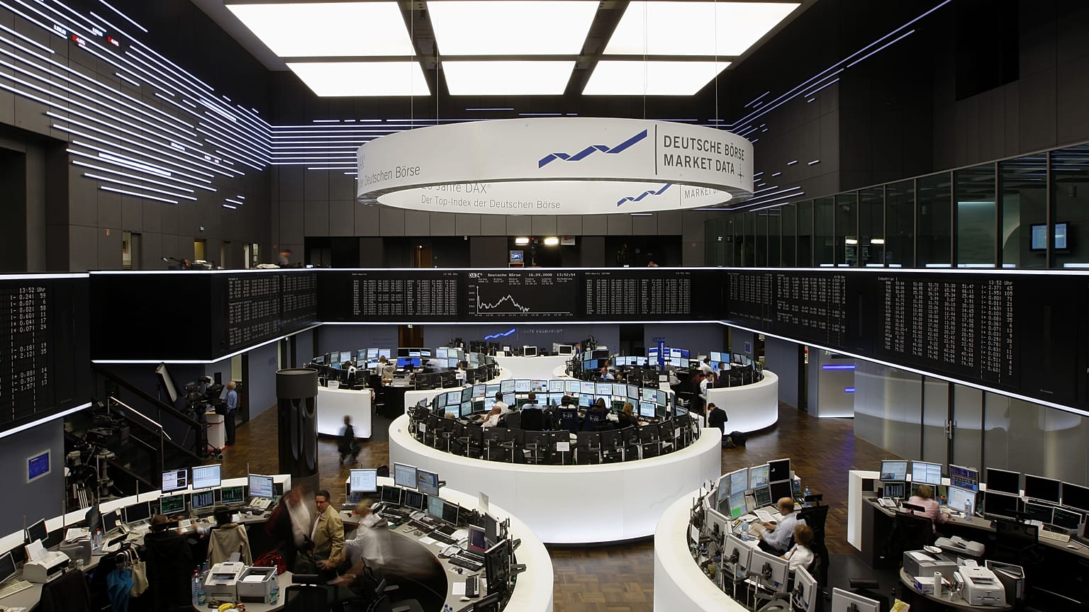 Brokers work at the stock exchange in Frankfurt, central Germany
