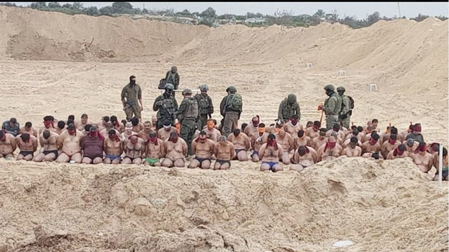 صورة مأخوذة من فيديو نشره الإعلام الإسرائيلي وفيه معتقلون فلسطينيون جبرهم الجيش الإسرائيلي على خلع ملابسهم