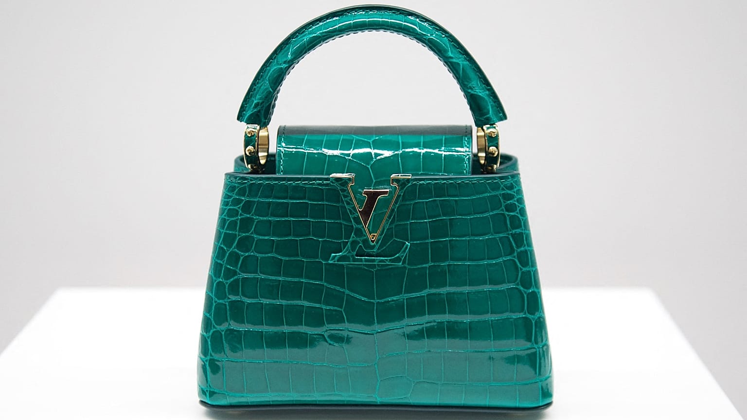 A picture taken on February 22, 2022 shows a Louis Vuitton Capucines handbag displayed during the inauguration of the Louis Vuitton workshop named "L'Abbaye" in Vendome, centr