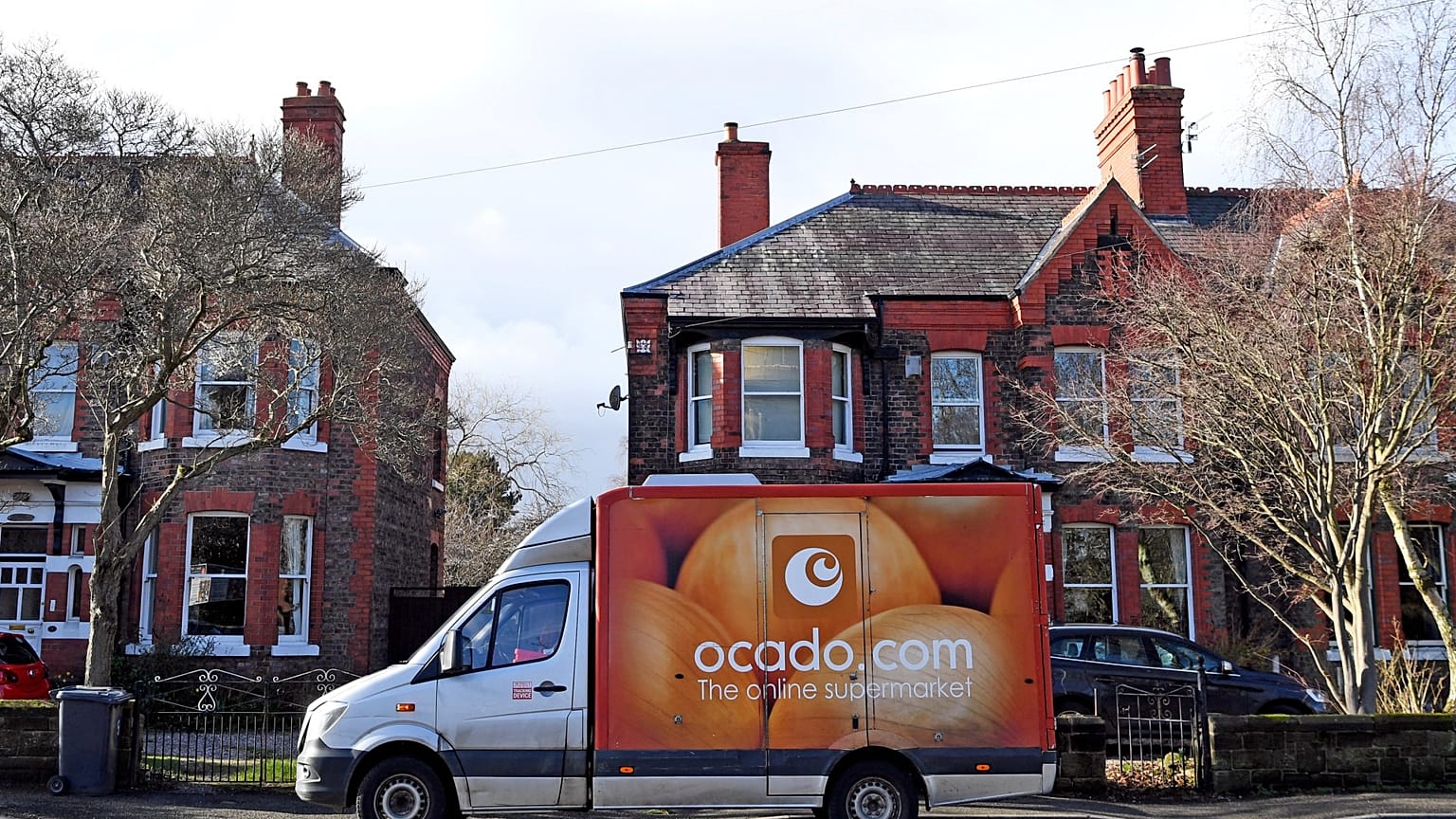 An Ocado delivery van parks outside a residential address near Liverpool in north west England, on February 10, 2019, during a delivery of food and drink for supermarket Waitr