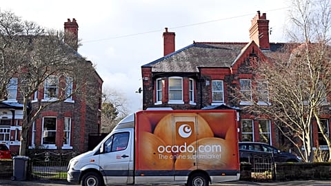 An Ocado delivery van parks outside a residential address near Liverpool in north west England, on February 10, 2019, during a delivery of food and drink for supermarket Waitr