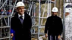 French President Emmanuel Macron (L) walks inside the nave during a visit of the reconstruction work at the Notre-Dame de Paris Cathedral.