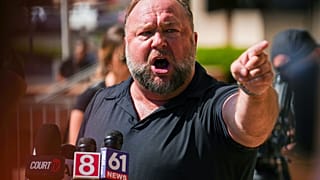 InfoWars founder Alex Jones speaks to the media outside Waterbury Superior Court during his trial in Waterbury, Connecticut last year