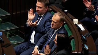 The leader of Poland's opposition Donald Tusk, center, after Poland's government losing a confidence vote at the parliament in Warsaw, Poland, Dec 11, 2023