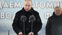 Picture distributed by Russian state agency Sputnik shows Vladimir Putin  attending a flag-rising ceremony at Sevmash shipyard on December 11, 2023.