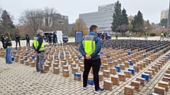 This image taken on December 12, 2023 shows a total of 11 tonnes of cocaine in plastic-wrapped packs from two seizures made by police in Valencia and Vigo.