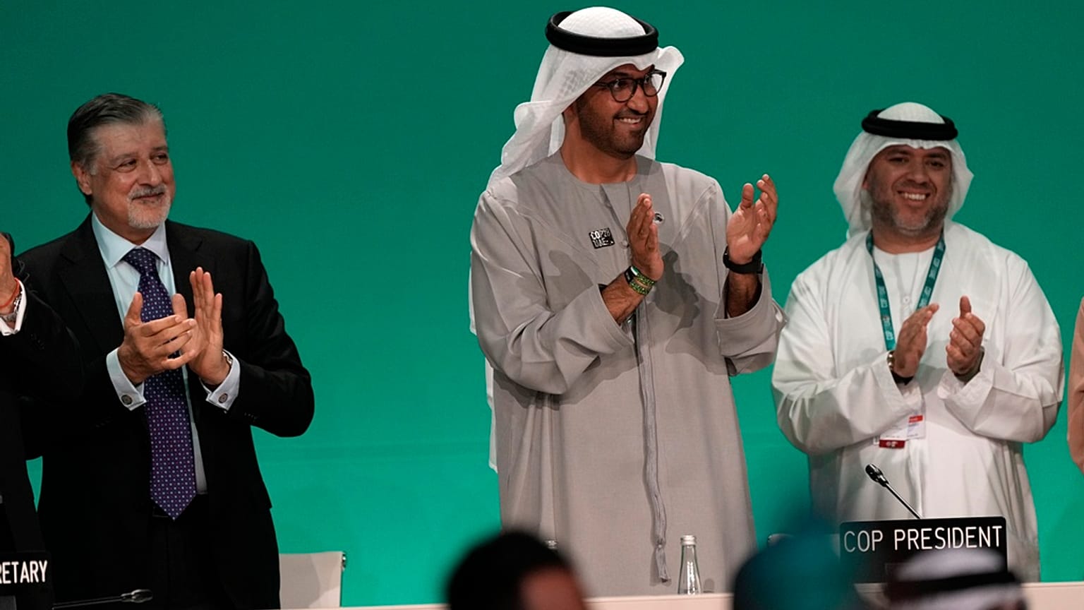 COP28 President Sultan al-Jaber, center, claps after passing the global stocktake at the COP28 U.N. Climate Summit, Wednesday, Dec. 13, 2023, in Dubai, United Arab Emirates.