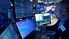 Specialist works at his post on the floor of the New York Stock Exchange