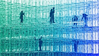 Construction workers prepare a scaffolding at a construction site in Mumbai, January 2022