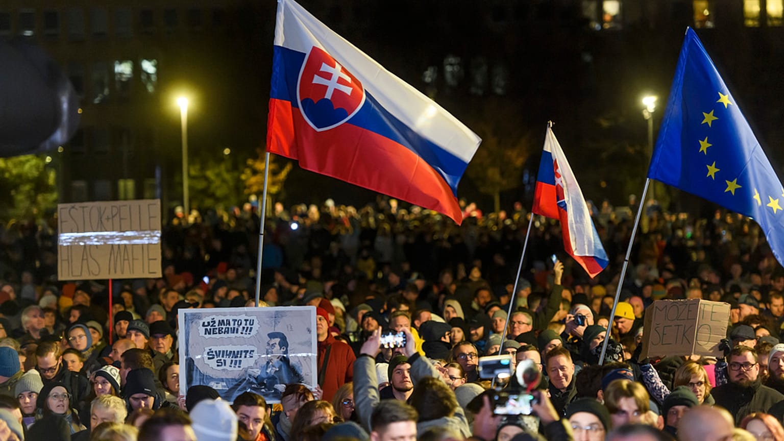 People take part in a protest against scrapping the Special Prosecutor's Office organised by the Slovakian opposition parties in front of the Government Office in Bratislava
